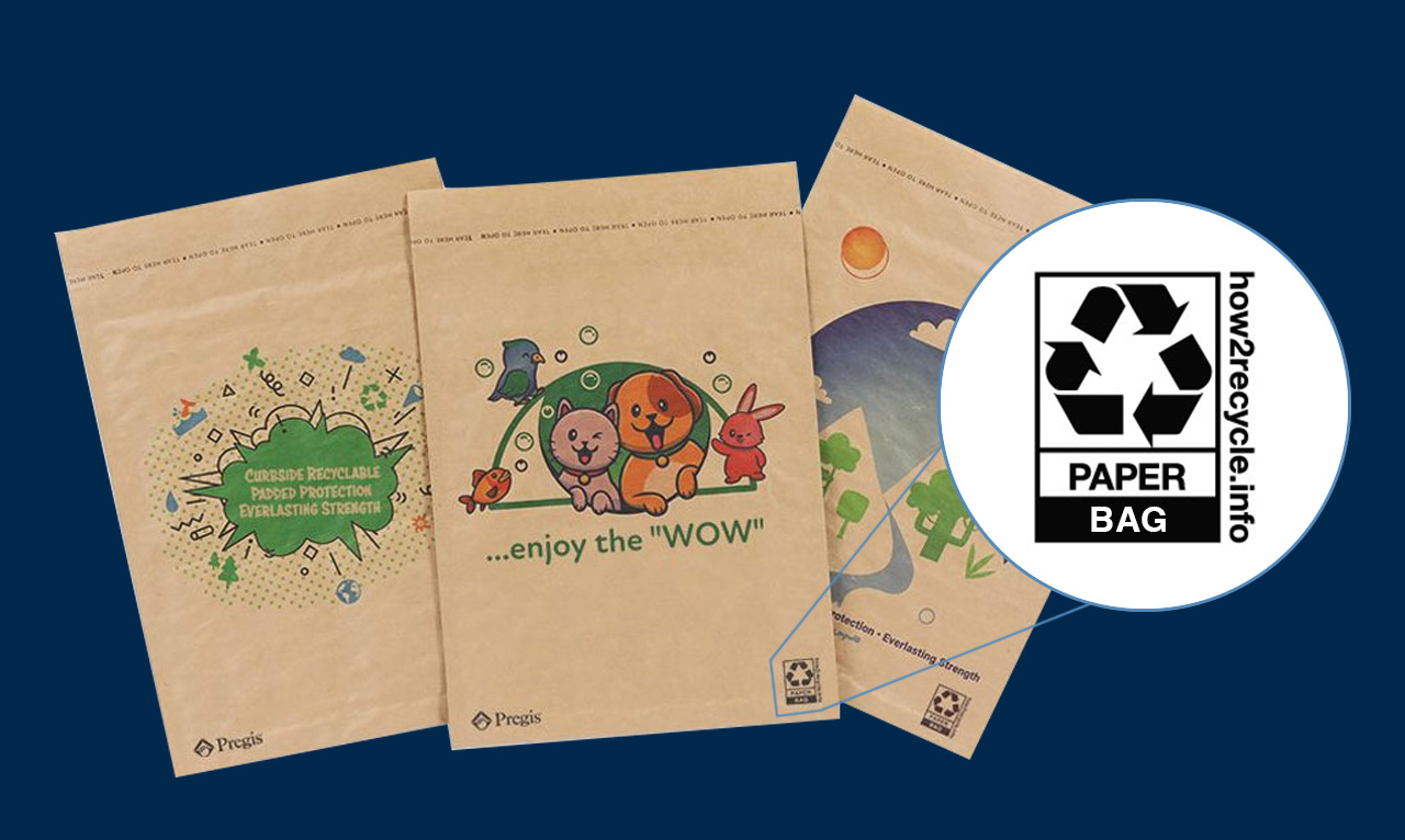 Three eco-friendly Pregis paper mailers displayed side by side on a dark blue background. Each mailer features unique designs: one highlights sustainability with text that reads 'Curbside Recyclable Padded Protection Everlasting Strength,' another features cartoon animals with the text '...enjoy the WOW,' and the third depicts a nature scene with mountains, trees, and a bright sun. A 'how2recycle.info' logo is shown enlarged on the right, indicating these are recyclable paper bags.